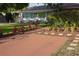 Exterior of home with a brick driveway featuring well-manicured landscaping and a lush lawn at 12021 144Th St, Largo, FL 33774