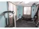 Home gym with rubber floor, workout equipment and natural light at 12021 144Th St, Largo, FL 33774