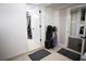 Hallway with multiple doors and golf equipment at 12021 144Th St, Largo, FL 33774