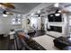 Bright living room with a cozy fireplace, built-in shelving, and comfortable seating at 12021 144Th St, Largo, FL 33774
