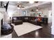 Comfortable living room with a large sectional sofa and hardwood floors at 12021 144Th St, Largo, FL 33774