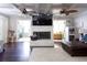 Bright living room with coffered ceilings, fireplace, and hardwood floors at 12021 144Th St, Largo, FL 33774