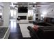 Relaxing living room area featuring a stone fireplace and dark wood flooring at 12021 144Th St, Largo, FL 33774