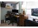 Well-equipped home office space with a desk, computer setup, and a comfortable chair at 12021 144Th St, Largo, FL 33774