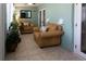 Bright sun room with comfortable seating, perfect for relaxation and plant display at 12021 144Th St, Largo, FL 33774