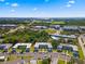Wide aerial shot of the condo complex with lush surrounding landscape at 1250 S Pinellas Ave # 405, Tarpon Springs, FL 34689