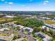 Aerial view of a condo complex with multiple buildings, parking lots, and surrounding greenery at 1250 S Pinellas Ave # 405, Tarpon Springs, FL 34689