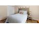 Bedroom featuring wood-look flooring, and an ornate headboard at 1250 S Pinellas Ave # 405, Tarpon Springs, FL 34689