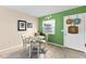 The dining area features neutral tile flooring, decorative lighting, and views to the kitchen space at 1250 S Pinellas Ave # 405, Tarpon Springs, FL 34689