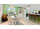 Inviting dining area with a large window and seamless access to the kitchen, perfect for Gathering meals at 1250 S Pinellas Ave # 405, Tarpon Springs, FL 34689
