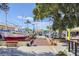 The dock area has benches, shops, and the shark statue in Tarpon Springs at 1250 S Pinellas Ave # 405, Tarpon Springs, FL 34689