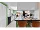 Bright, updated kitchen with modern appliances and a breakfast bar overlooking the dining area at 1250 S Pinellas Ave # 405, Tarpon Springs, FL 34689