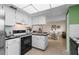 Stylish kitchen featuring ample counter space, modern appliances, and seamless access to the dining area at 1250 S Pinellas Ave # 405, Tarpon Springs, FL 34689