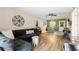 Comfortable living room featuring a cozy sofa, natural light, and access to the dining area at 1250 S Pinellas Ave # 405, Tarpon Springs, FL 34689
