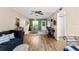 Relaxing living area with a ceiling fan and seamless flow to the dining space at 1250 S Pinellas Ave # 405, Tarpon Springs, FL 34689