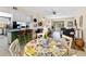 Open living room featuring hardwood floors, modern furniture, and access to the outdoor patio at 1250 S Pinellas Ave # 405, Tarpon Springs, FL 34689