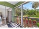 Patio with indoor/outdoor access and a view to the landscaped grounds at 1250 S Pinellas Ave # 405, Tarpon Springs, FL 34689