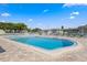 Sparkling community pool surrounded by manicured landscaping and multiple lounge chairs available for residents to use at 1250 S Pinellas Ave # 405, Tarpon Springs, FL 34689