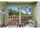 Sunroom with large windows overlooking landscaped yard at 1250 S Pinellas Ave # 405, Tarpon Springs, FL 34689
