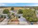 Aerial view of a single-story home featuring a well manicured lawn, mature landscaping, and a two car garage at 12790 118Th St, Seminole, FL 33778