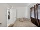 Comfortable bedroom with cozy decor and a view of the closet and door at 12790 118Th St, Seminole, FL 33778