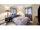 Bedroom features neutral walls, two windows and lamp lit bedside tables at 12790 118Th St, Seminole, FL 33778
