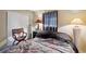 Bedroom features neutral walls, window, and comfortable seating area at 12790 118Th St, Seminole, FL 33778
