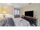 Bedroom with tv, dresser, window, and neutral walls at 12790 118Th St, Seminole, FL 33778