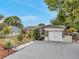 Attractive property featuring rock accents, landscaping, and ample parking space for convenience at 12790 118Th St, Seminole, FL 33778