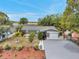 Inviting curb appeal with landscaped front yard and charming features, perfect for a cozy and welcoming home at 12790 118Th St, Seminole, FL 33778