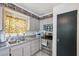 Kitchen features stainless steel appliances, tile floors, and neutral walls at 12790 118Th St, Seminole, FL 33778