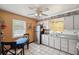Kitchen features tile floors, seating, and stainless steel refrigerator at 12790 118Th St, Seminole, FL 33778