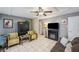 Comfortable living room with TV, sofa, fireplace, and stylish decor at 12790 118Th St, Seminole, FL 33778