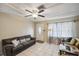 Spacious living room with plenty of natural light and comfortable seating arrangement at 12790 118Th St, Seminole, FL 33778