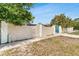 Property line along the side of the home showing decorative gate and block fence for privacy at 1403 Garden Ave, Tarpon Springs, FL 34689