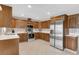 Spacious kitchen with stainless steel appliances, wood cabinets, and white countertops at 1403 Garden Ave, Tarpon Springs, FL 34689
