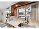 Bright kitchen with stainless steel sink overlooking the pool area and a tiled floor at 1403 Garden Ave, Tarpon Springs, FL 34689