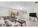 Cozy living room with a plush sofa, natural light, and stylish coffee table at 1403 Garden Ave, Tarpon Springs, FL 34689