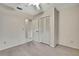 Bedroom featuring an ensuite, with a closet for storage, and neutral carpeting at 14615 Daybreak Dr, Lutz, FL 33559