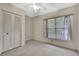 Cozy bedroom with ample closet space and natural light from a window at 14615 Daybreak Dr, Lutz, FL 33559