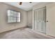 Bedroom featuring a double closet, a window, and plush carpeting at 14615 Daybreak Dr, Lutz, FL 33559