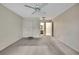 Bedroom with a view of the ensuite, featuring neutral walls and carpeted flooring at 14615 Daybreak Dr, Lutz, FL 33559