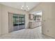 Dining area with tile floors, natural lighting, and easy access to kitchen at 14615 Daybreak Dr, Lutz, FL 33559