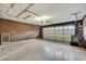 Spacious two car garage with storage shelving and automatic door; ready for your vehicles and projects at 14615 Daybreak Dr, Lutz, FL 33559