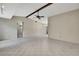 Bright living room with tile flooring, open layout, and a ceiling fan for added comfort at 14615 Daybreak Dr, Lutz, FL 33559