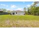Back exterior view of home with lawn, patio and fence at 15062 Hummingbird Rd, Weeki Wachee, FL 34614