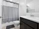 Bathroom featuring a shower with gray curtain, a modern vanity with sink, and tile flooring at 15062 Hummingbird Rd, Weeki Wachee, FL 34614