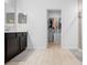 Bathroom showcasing the vanity, shower, and walk-in closet at 15062 Hummingbird Rd, Weeki Wachee, FL 34614