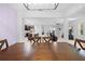 Open concept living and dining area featuring modern lighting and a view into the gourmet kitchen at 15062 Hummingbird Rd, Weeki Wachee, FL 34614
