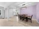 Bright dining room with wood table and chairs, tile floors, and modern chandelier at 15062 Hummingbird Rd, Weeki Wachee, FL 34614